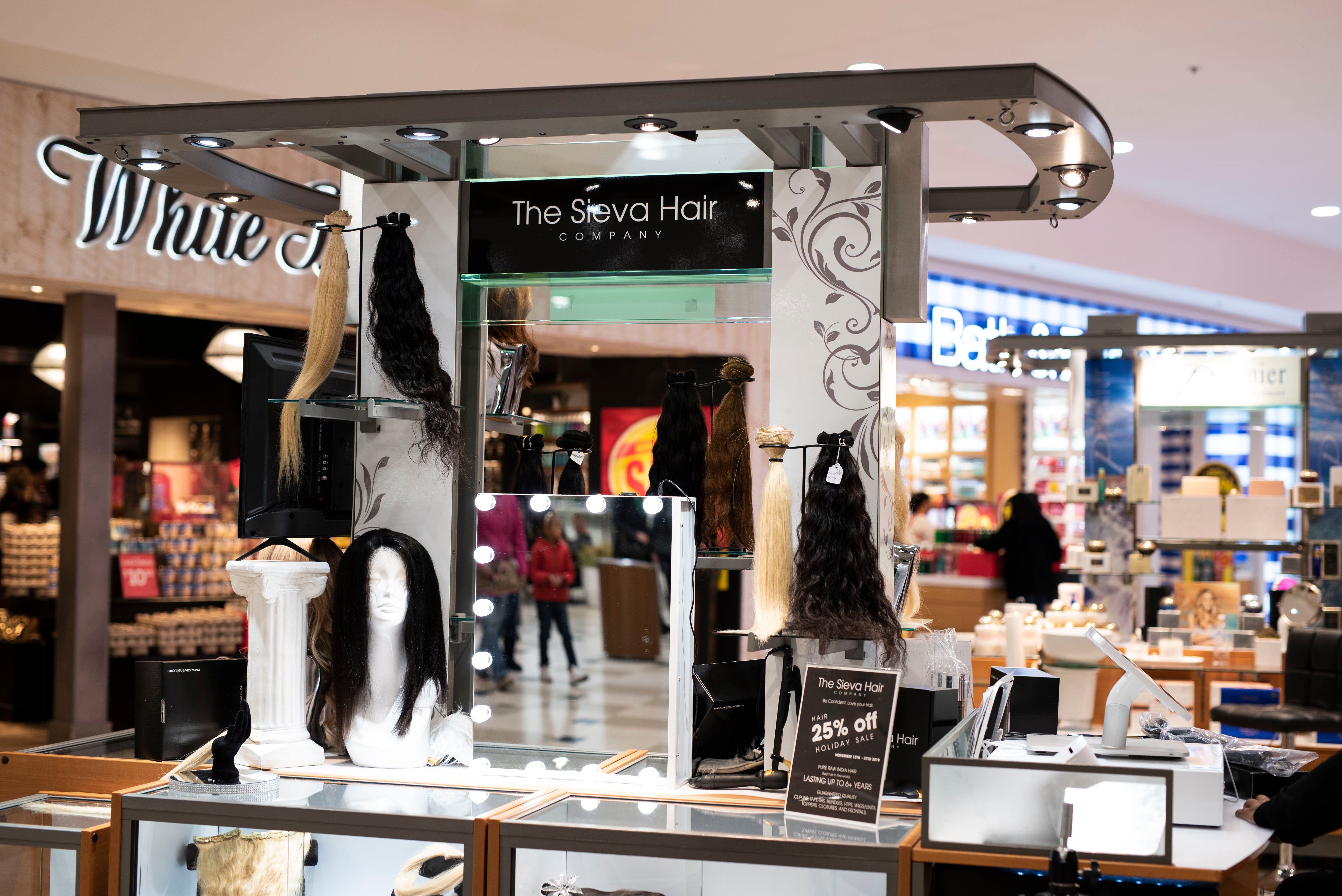 The Sieva Hair Company tape-in extensions on black packaging