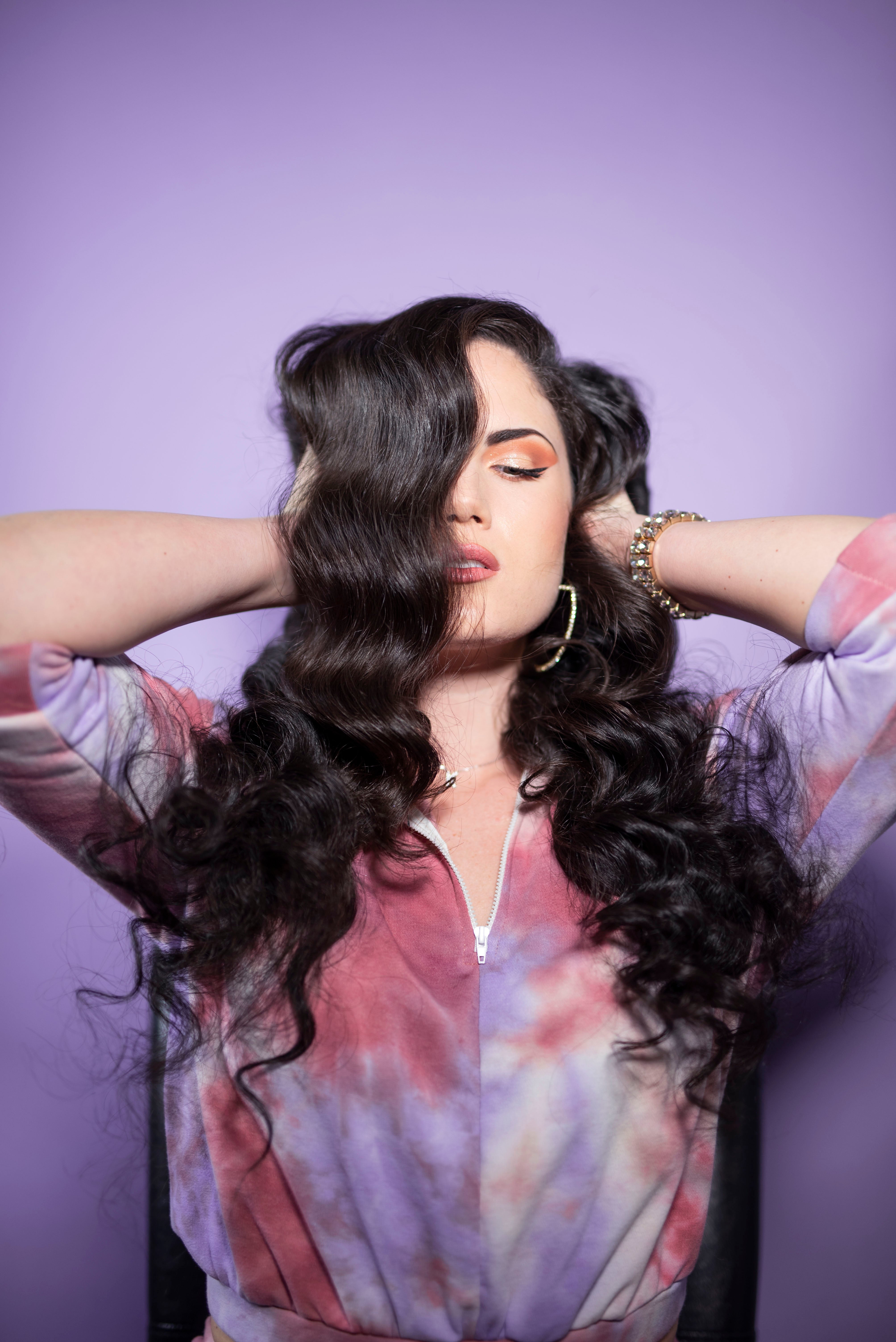 Woman with long, dark, wavy hair