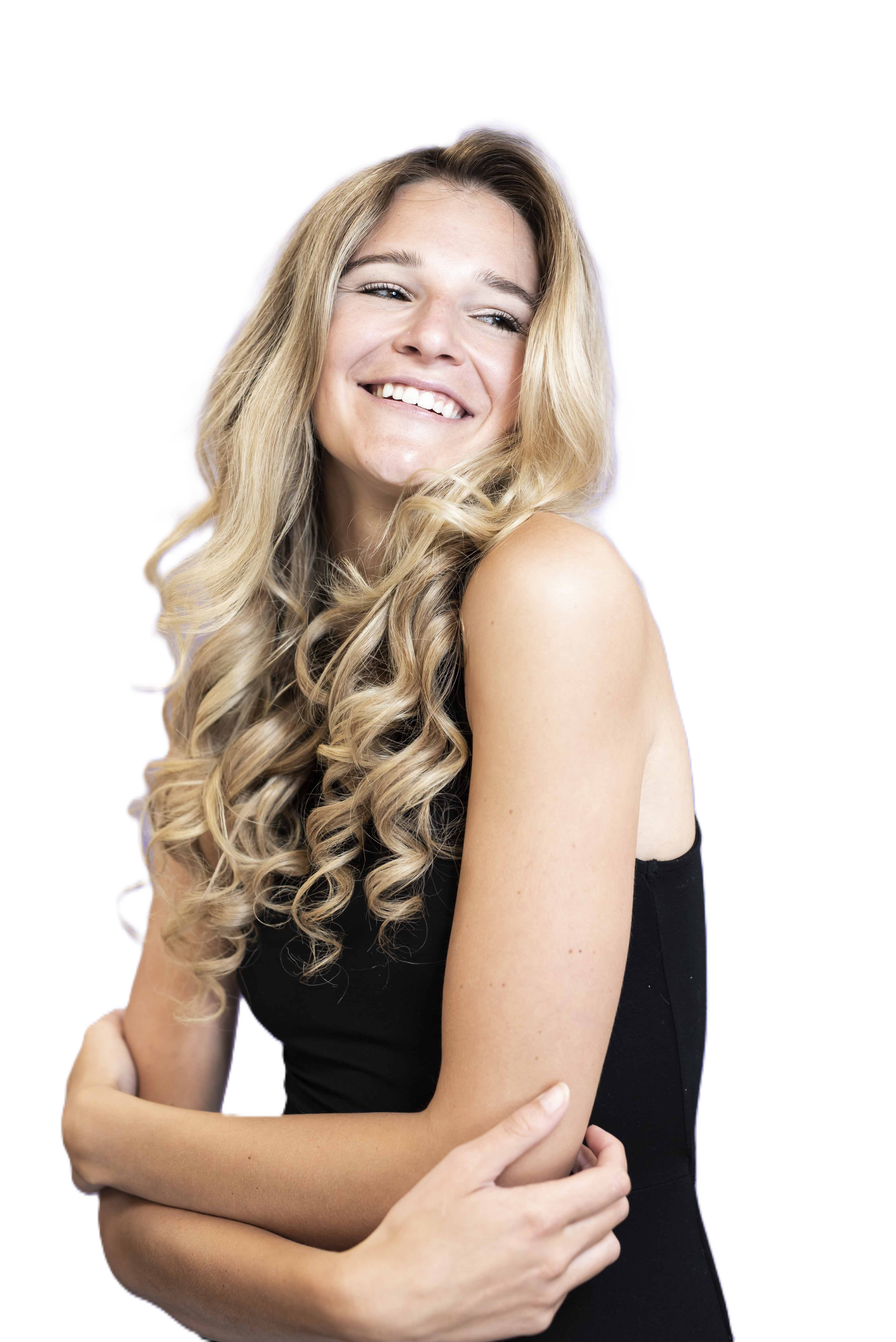 Smiling woman with long, dark, wavy hair